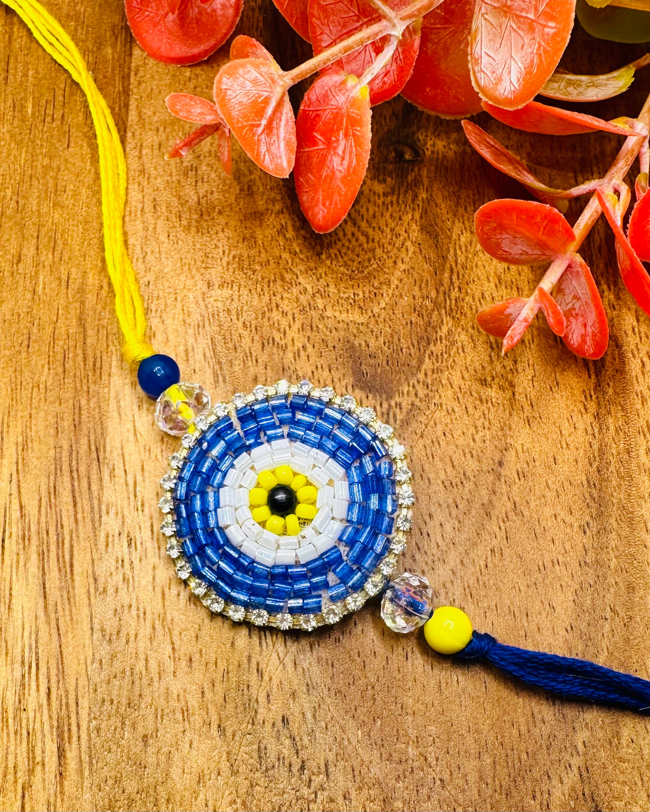 Blue And Yellow Evil Eye Bhaiya And Bhabhi Rakhi Set