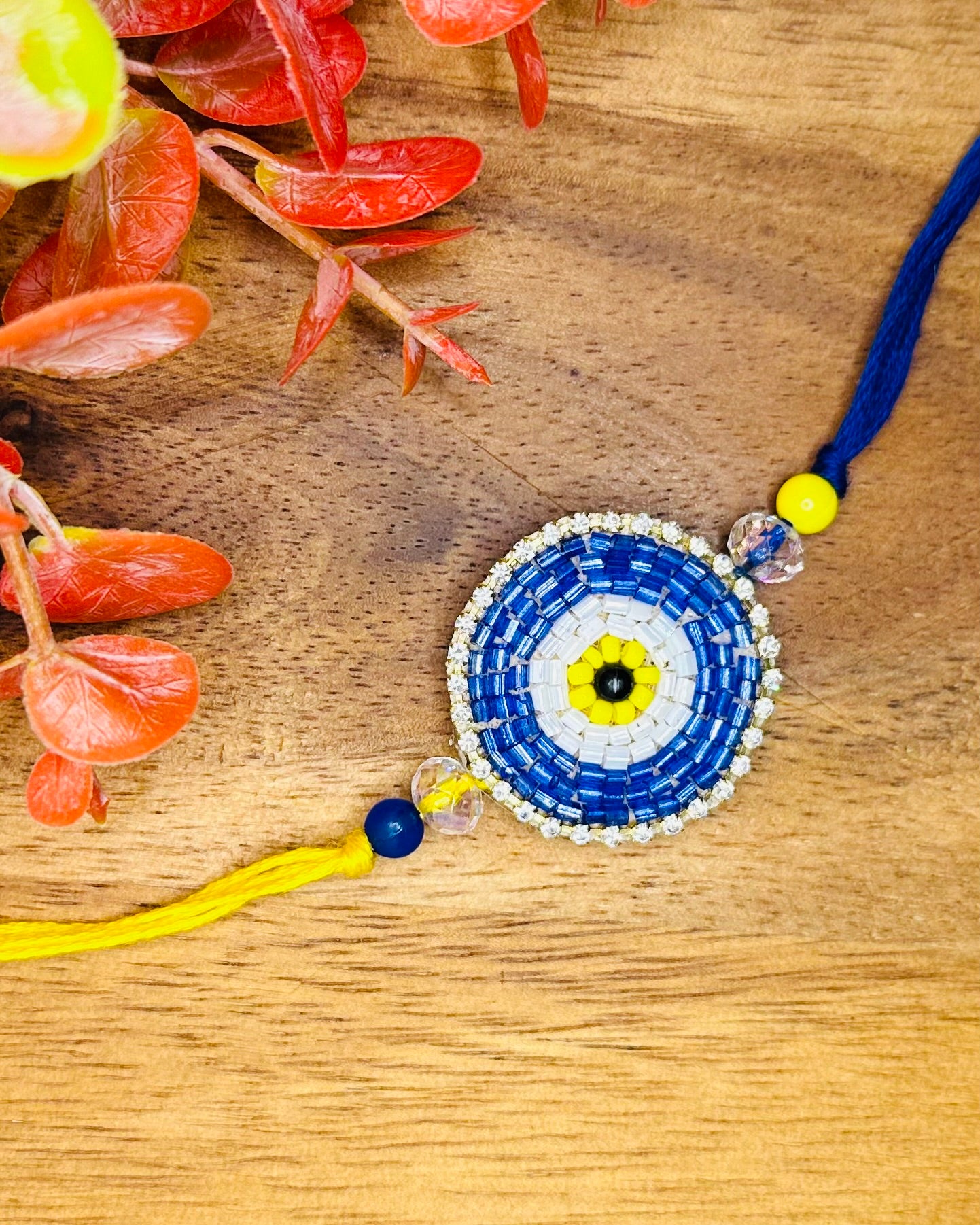 Blue And Yellow Evil Eye Bhaiya And Bhabhi Rakhi Set