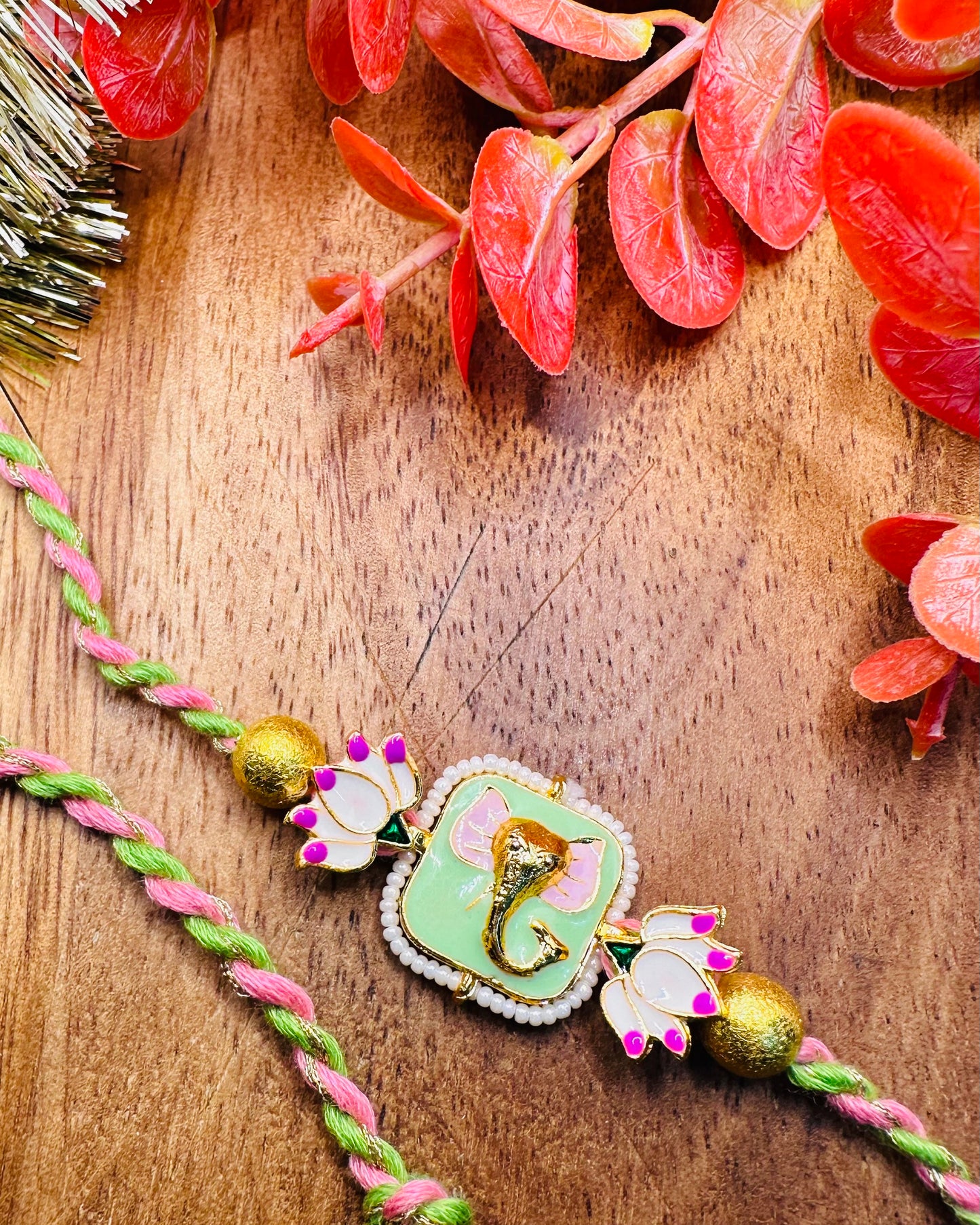 Premium Ganesha Rakhi With Lotus Details