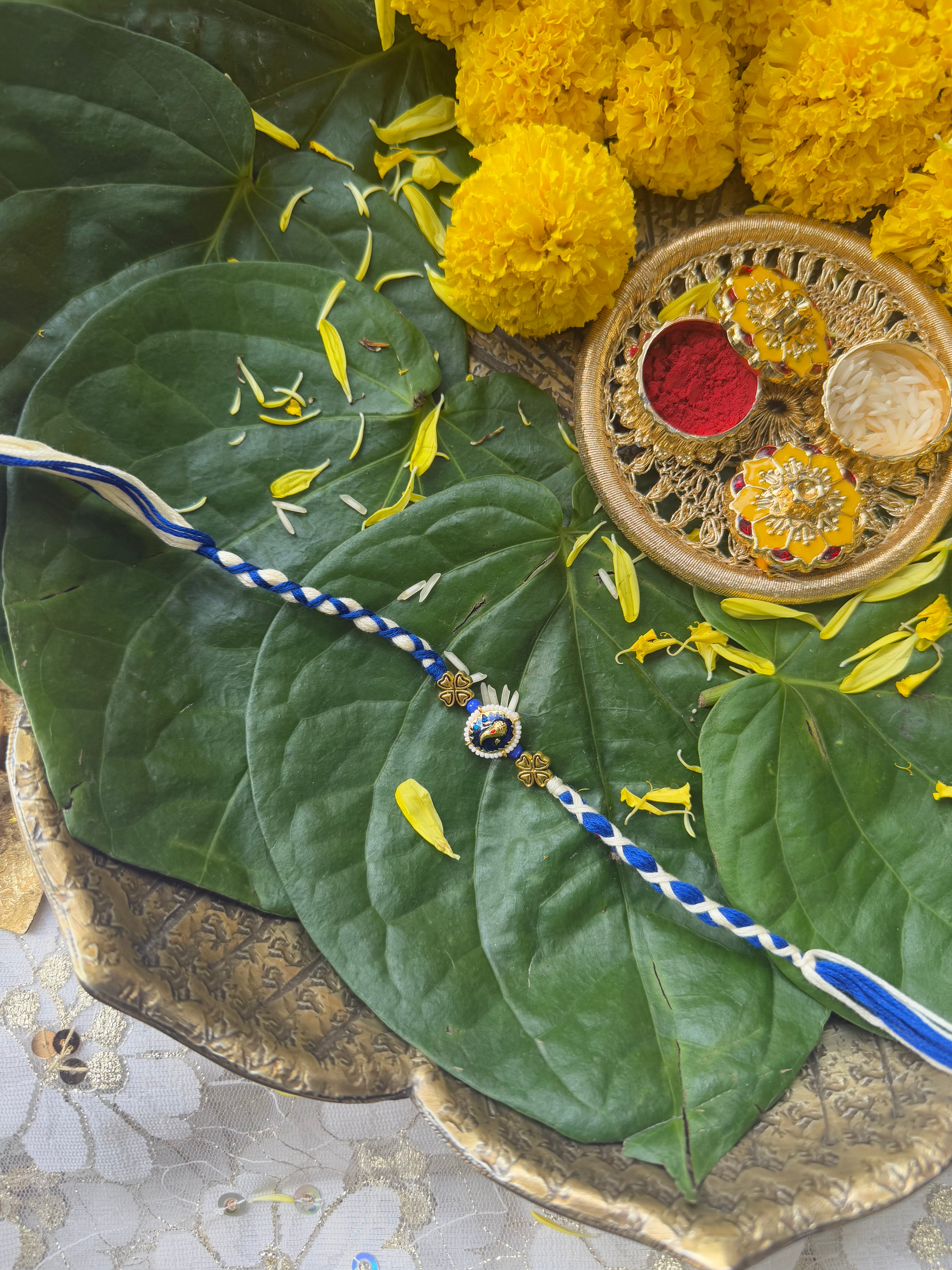 CLASSY GANESHA FACE RAKHI