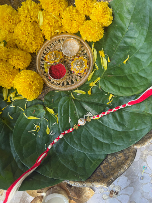 CLASSY GANESHA FACE RAKHI