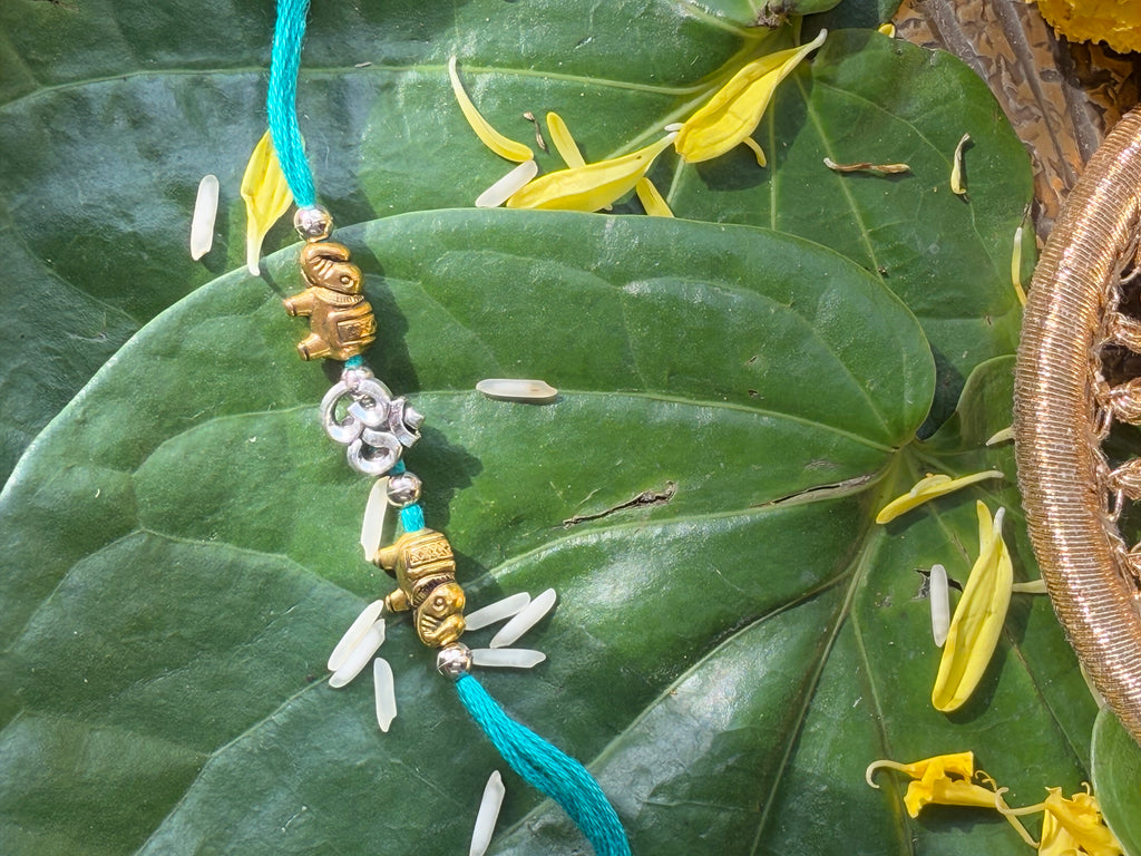 SILVER OM RAKHI