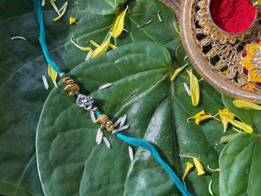 SILVER OM RAKHI