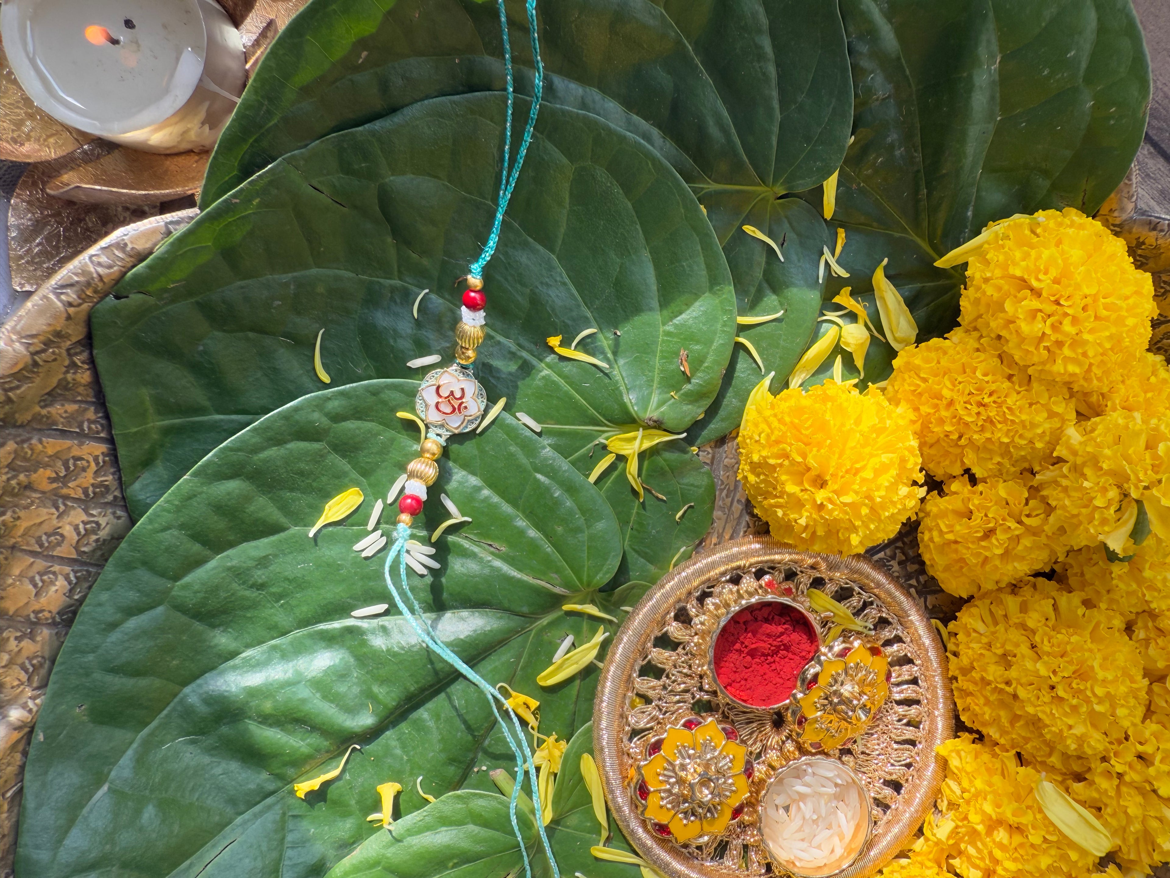 OM WITH MOTHER OF PEARL RAKHI