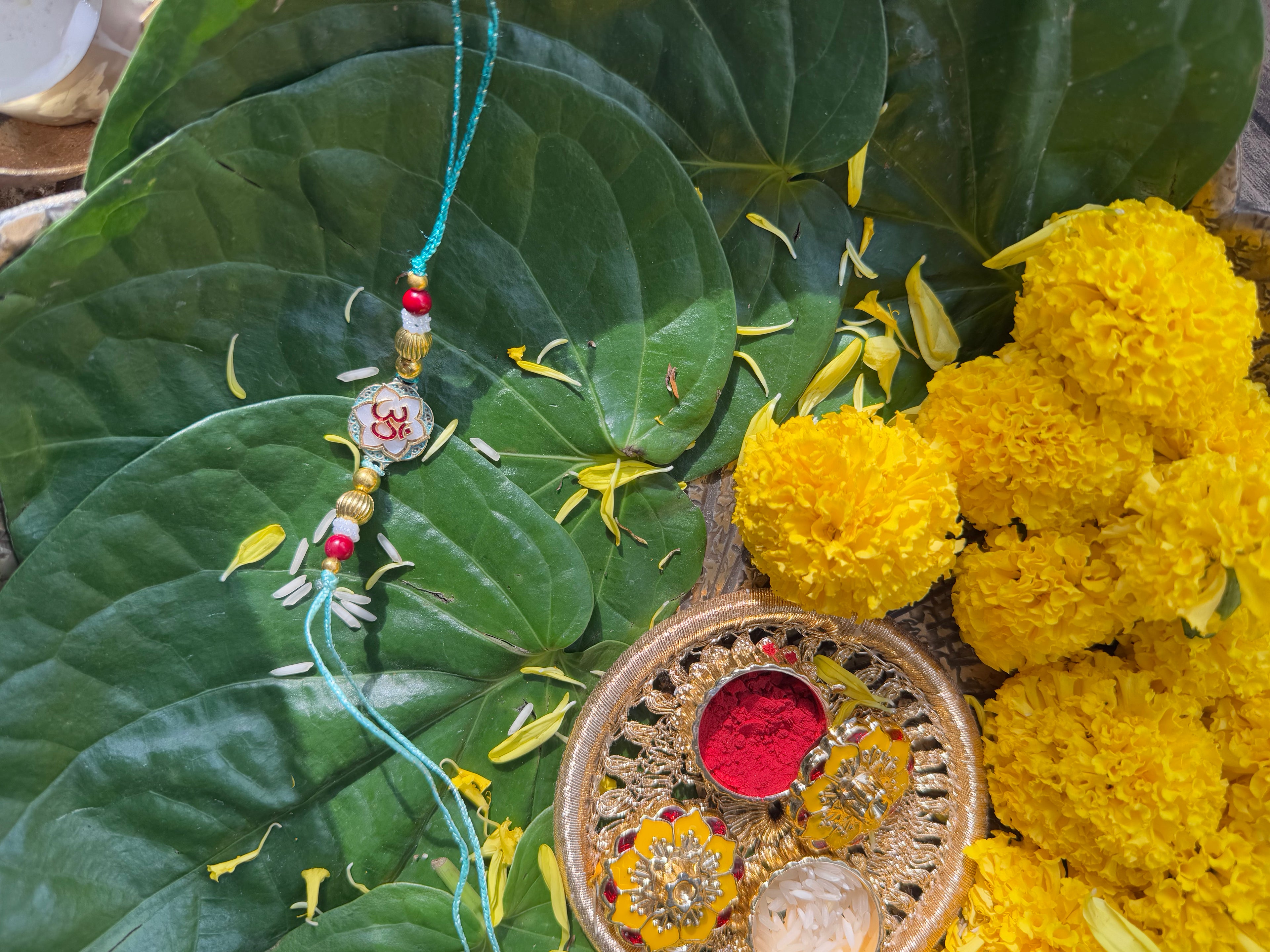 OM WITH MOTHER OF PEARL RAKHI
